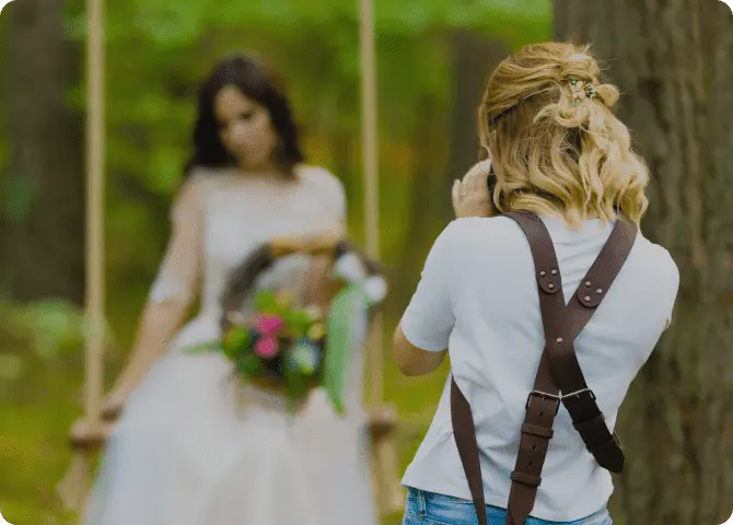 A photographer with a bride