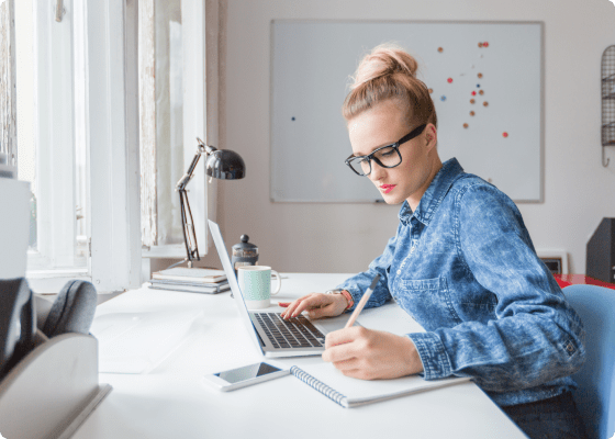 women working on her desk 