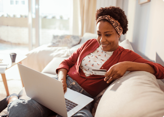 happy client paying with card laptop