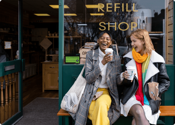 two women sitting at coffee shop