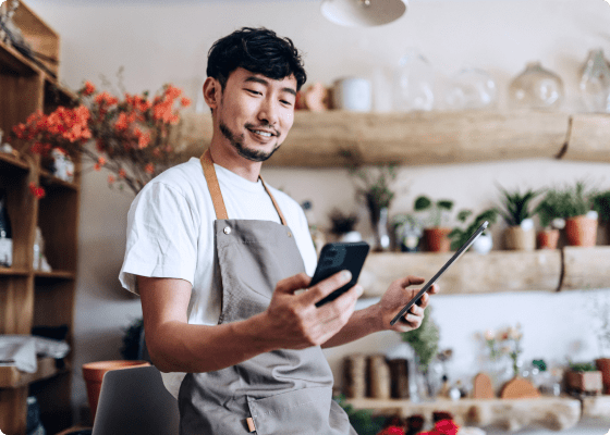 happy guy scrolling at his devices