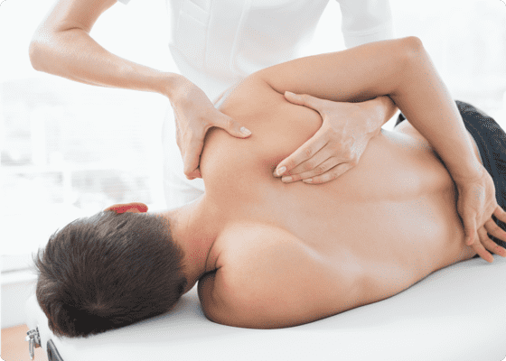 Hands massaging a man's back