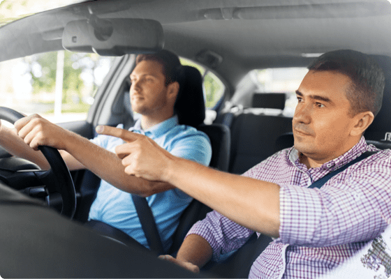 DMV instructor guiding a learning student to drive