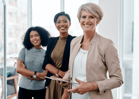 Three ladies standing in a showroom