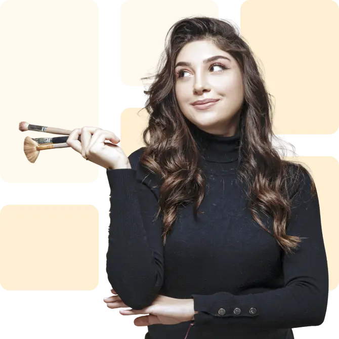Lash artist holding brush
