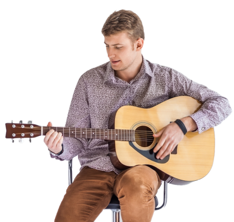 man playing guitar sat on chair