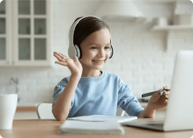 Smiling girl waving hand at Computer