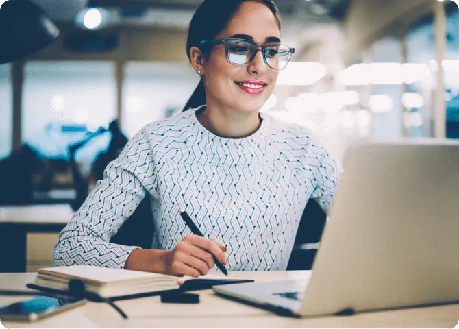 Smiling lady looking at computer