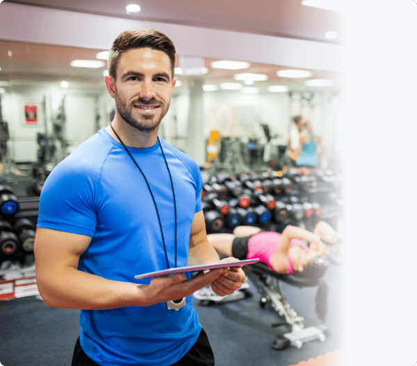 a man holding an ipad and smiling