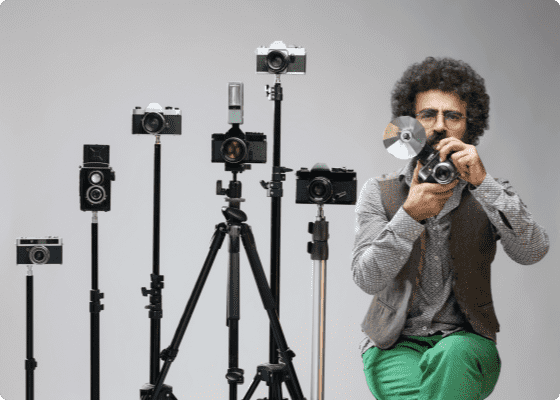 man with many cameras
