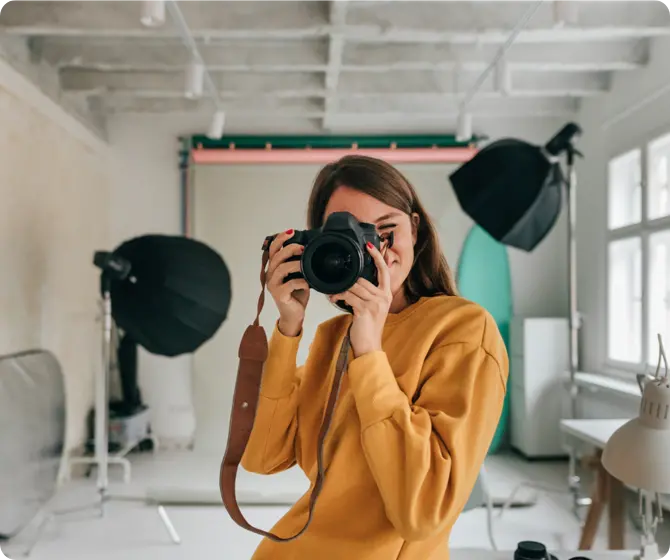 woman in studio clicking picture