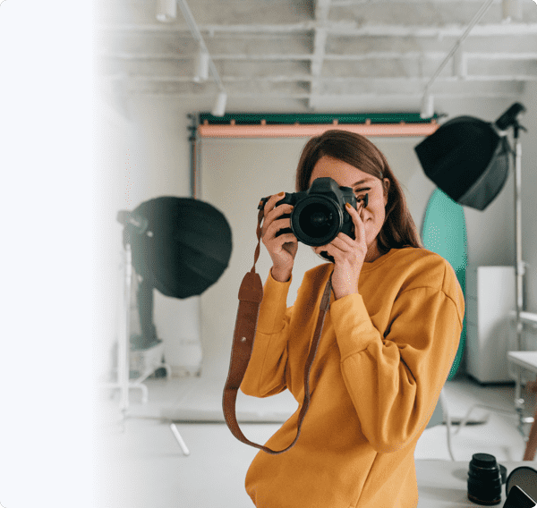 woman in studio clicking picture