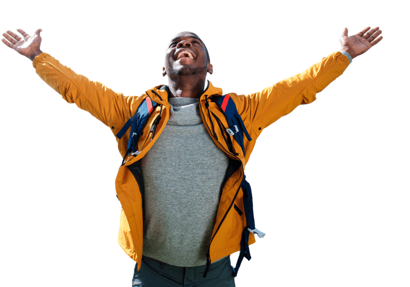A man in yellow jacket with hands up