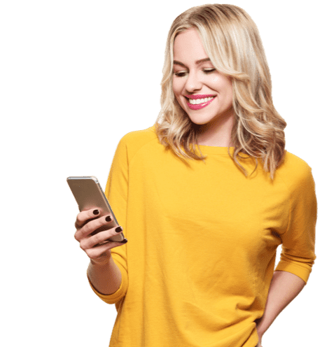 Smiling woman in yellow top looking at her mobile