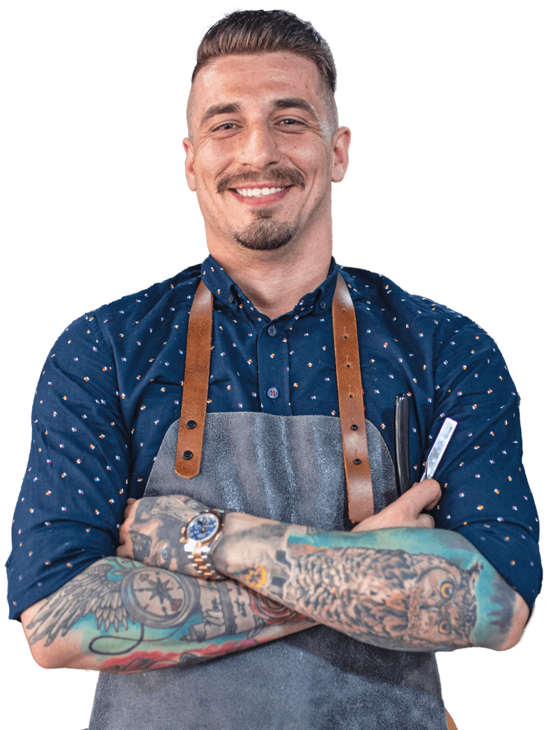 barber professional with tattoos in his hand