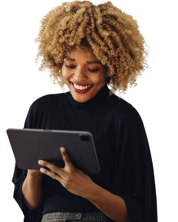 Smiling client scheduling appointments on tablet